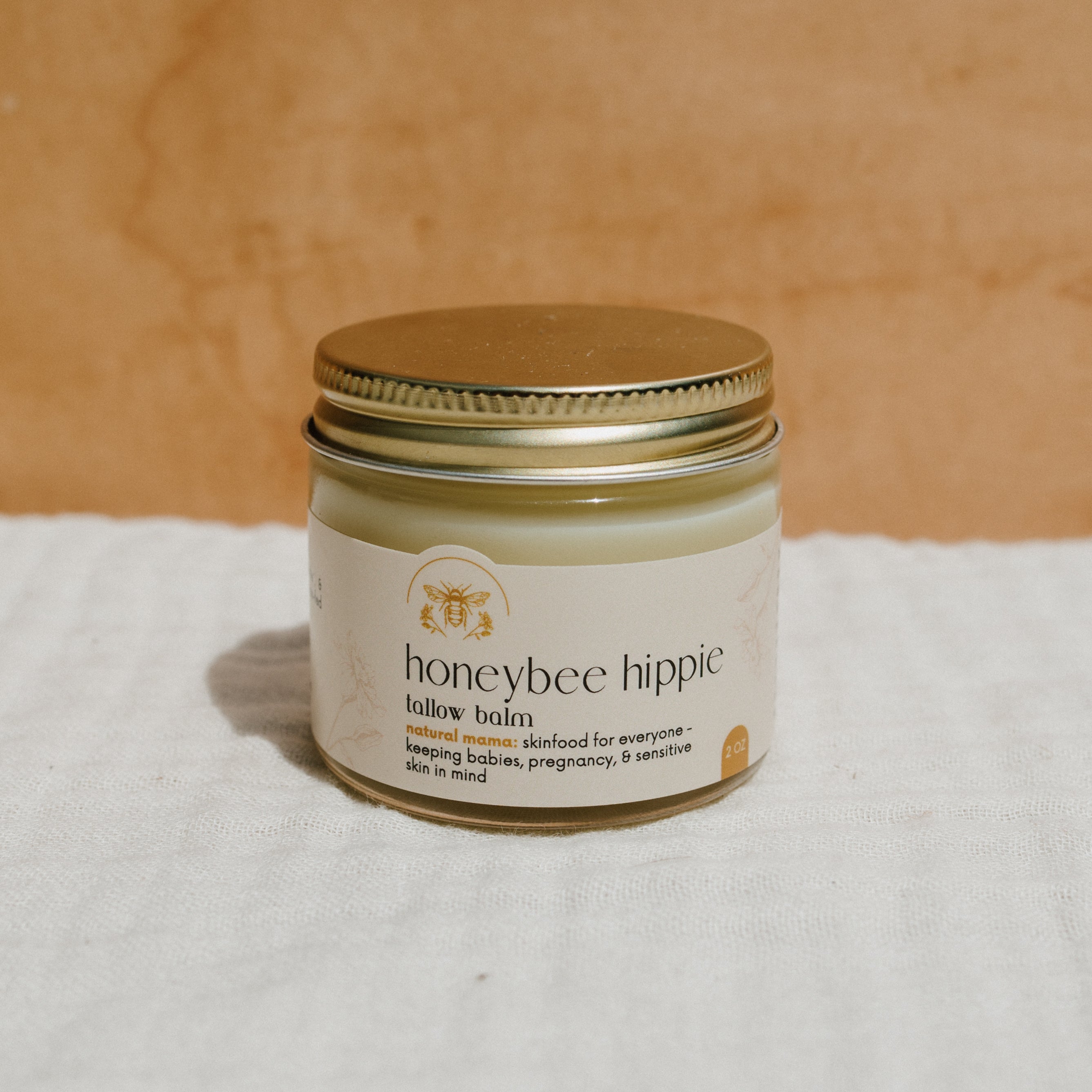 Natural Mama Tallow Butter in a Honeybee Hippie Tallow Whip jar, creamy and smooth, showcasing a handmade skincare product.