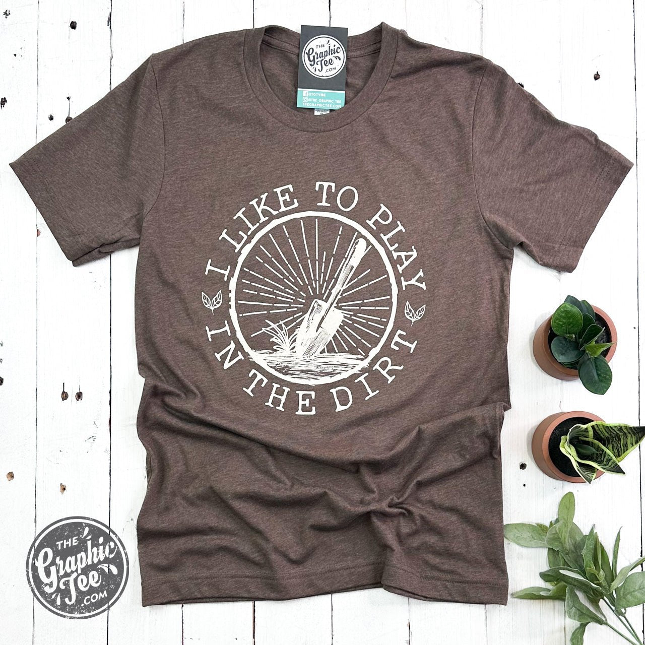 The Graphic Tee I Like to Play in the Dirt crewneck short sleeve graphic tee featuring playful dirt-themed design on white fabric.