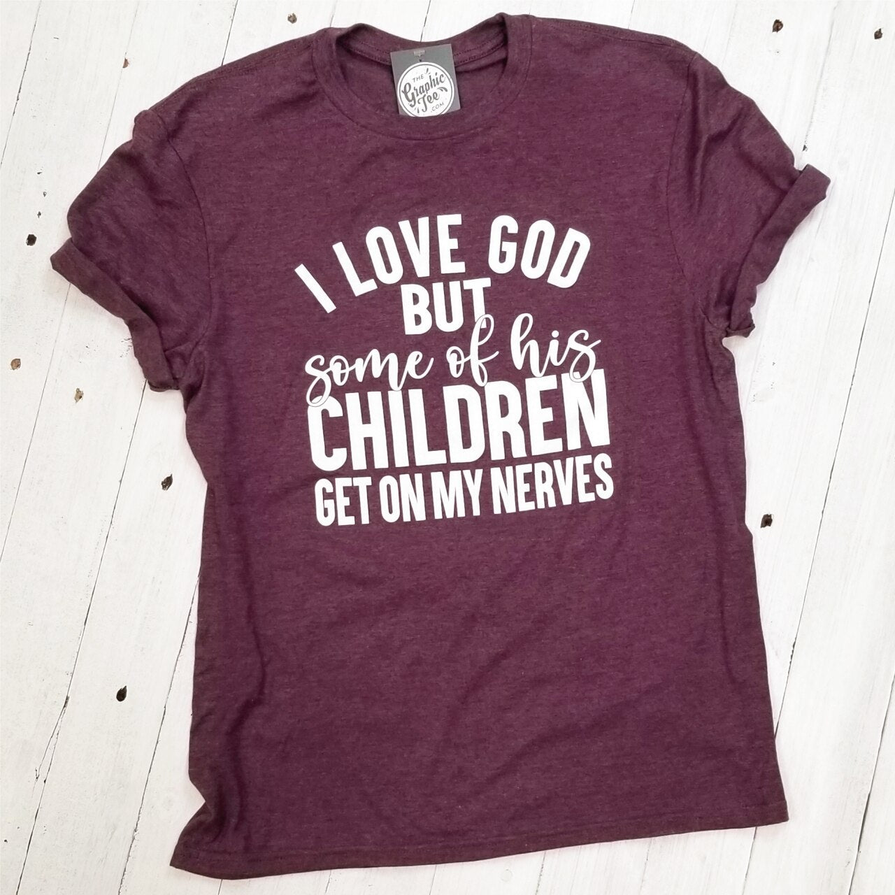Adult SS graphic tee from The Graphic Tee featuring the message "I Love God, But Some of His Children."