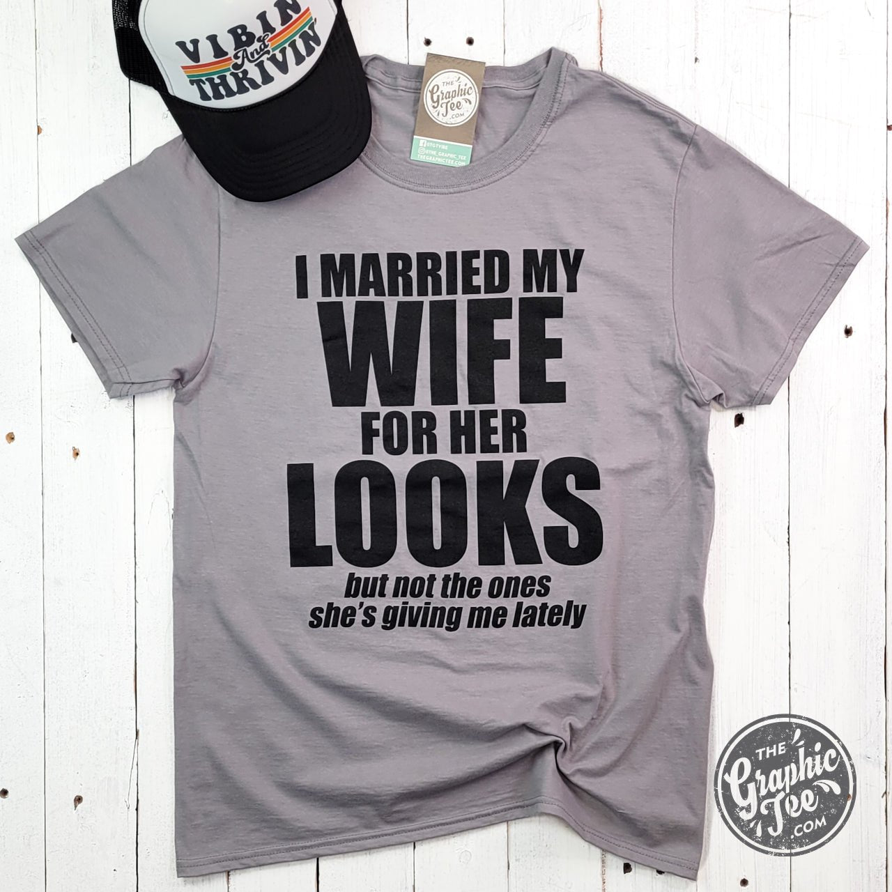Unisex SS graphic tee from The Graphic Tee with humorous "I Married My Wife For Her Looks" design, casual and comfortable fit.