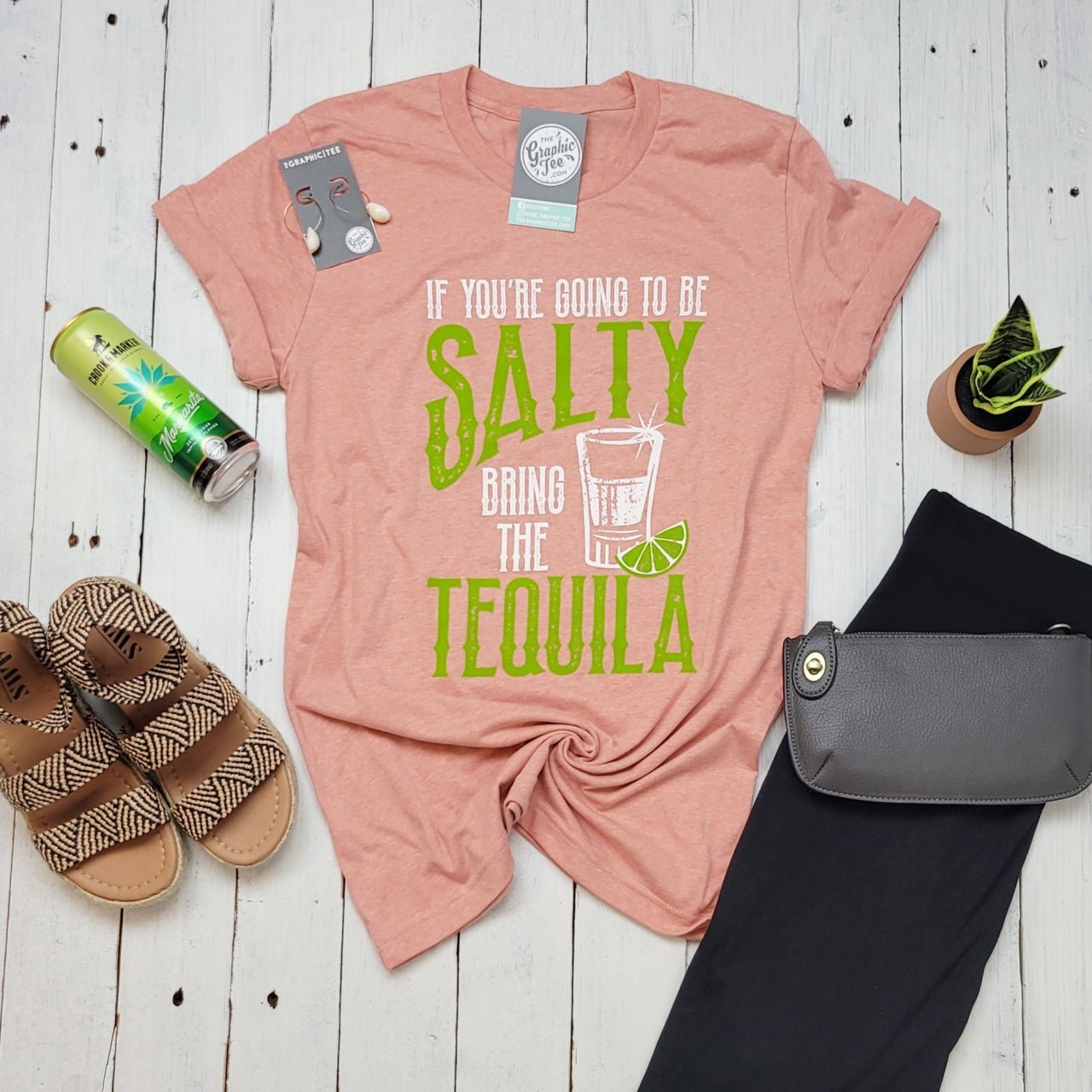 The Graphic Tee short sleeve crew neck graphic t-shirt features a humorous salty tequila design on a casual white tee.