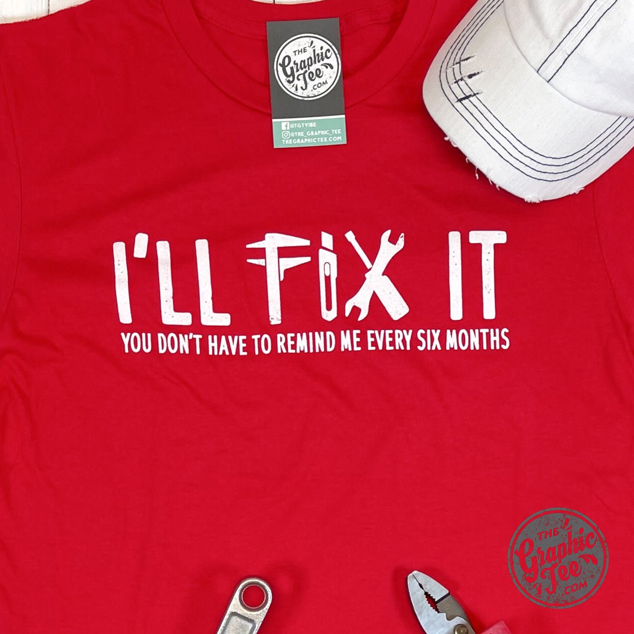 Short sleeve graphic tee from The Graphic Tee featuring "I'll Fix It" design on a casual black T-shirt.