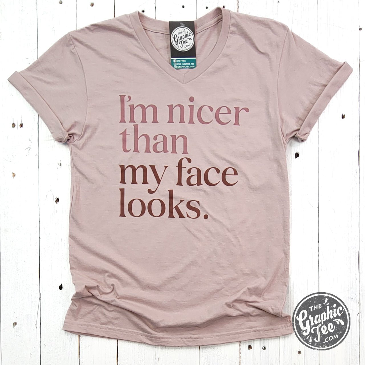 Gray V-neck T-shirt with humorous "I'm Nicer Than My Face Looks" graphic, casual short-sleeve tee by The Graphic Tee.