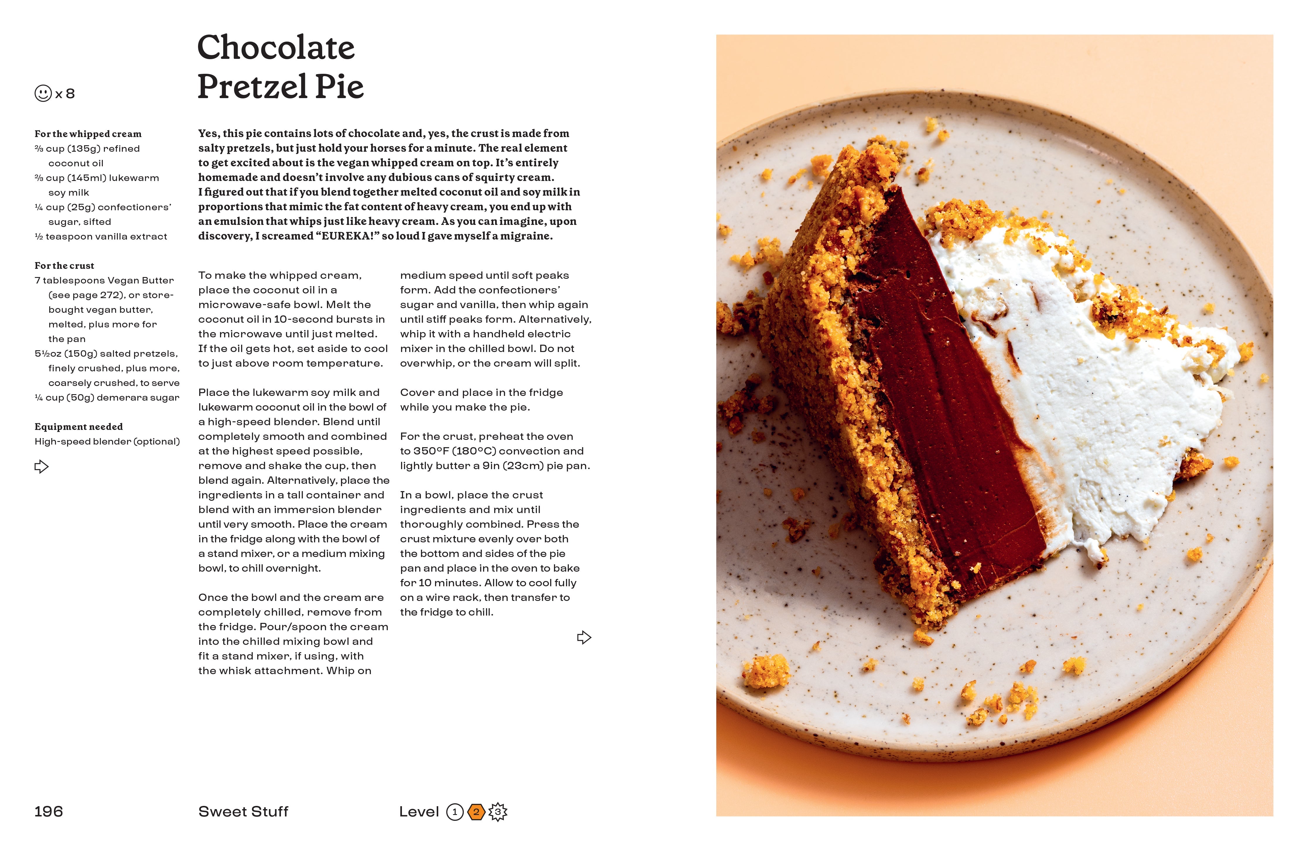 Hardcover cookbook titled "Anything You Can Cook, I Can Cook Vegan" by Insight Editions, featuring colorful plant-based dishes.