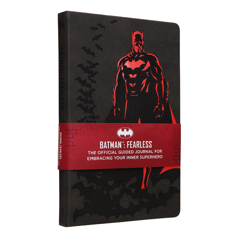 Hardcover book titled Batman: Fearless by Insight Editions featuring a dark, illustrated cover with Batman imagery.