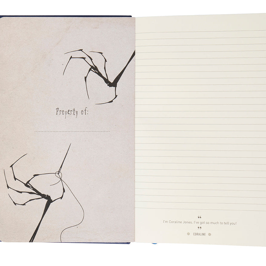 Insight Editions Coraline hardcover ruled journal with black cover and embossed design, ideal for writing and note-taking.