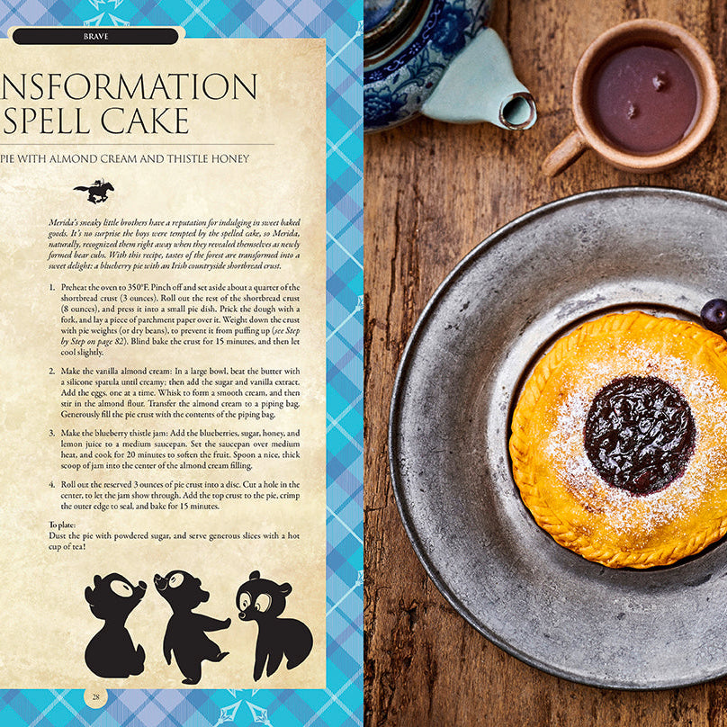 Hardcover Disney Enchanted Baking book by Insight Editions featuring magical baking recipes and whimsical illustrations.