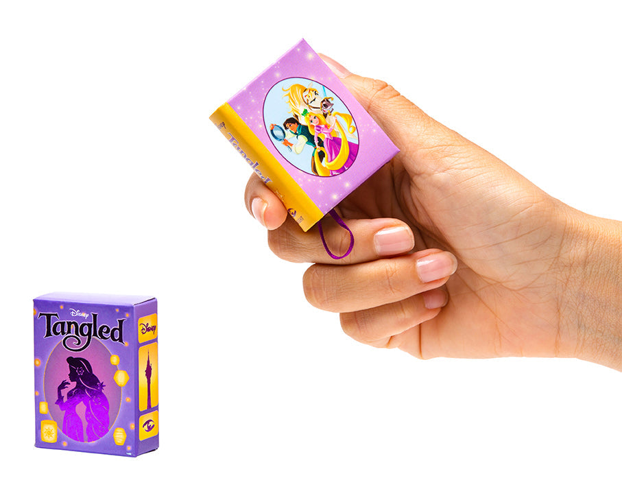 Hardcover Disney Tangled book by Insight Editions featuring colorful cover art and illustrations from the animated film.