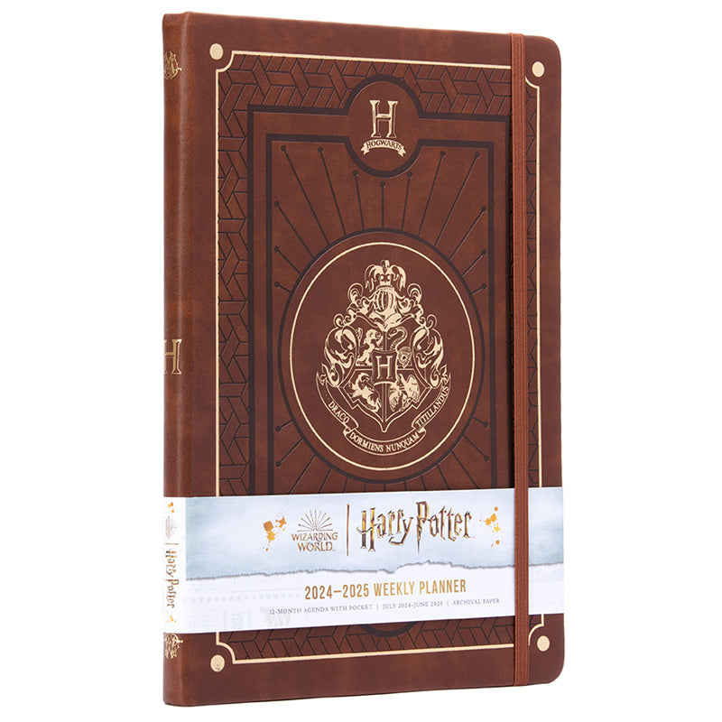 Hardcover Harry Potter 2024-2025 academic year planner by Insight Editions, featuring magical cover art and organized pages inside.