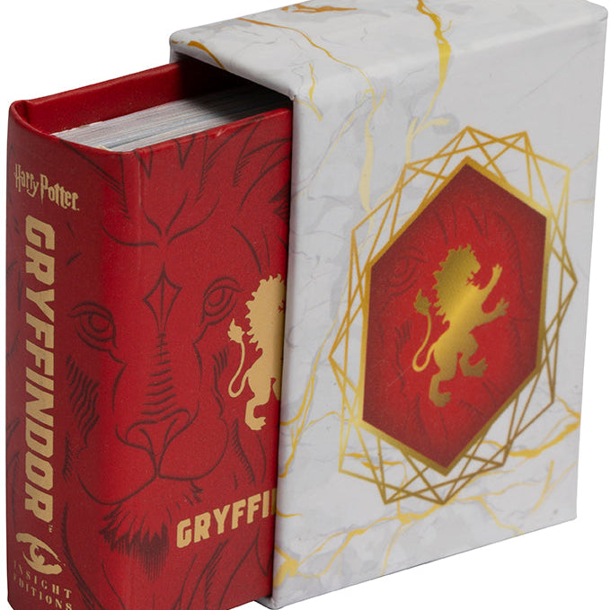 Hardcover Harry Potter Gryffindor book by Insight Editions with the iconic Gryffindor crest on the cover.