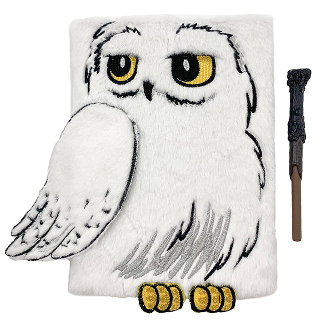 Hardcover Harry Potter Hedwig plush journal by Insight Editions, featuring a detailed Hedwig owl design for writing and collecting.