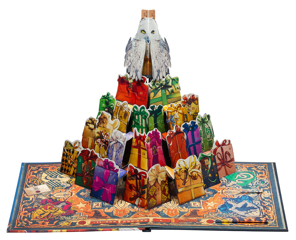 Hardcover Harry Potter Hedwig Pop-Up Advent Calendar by Insight Editions, featuring magical owl illustrations and festive holiday scenes.
