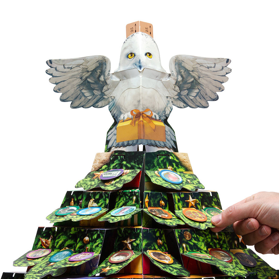 Hardcover Harry Potter Hedwig pop-up advent calendar by Insight Editions featuring magical owl illustrations and festive design.