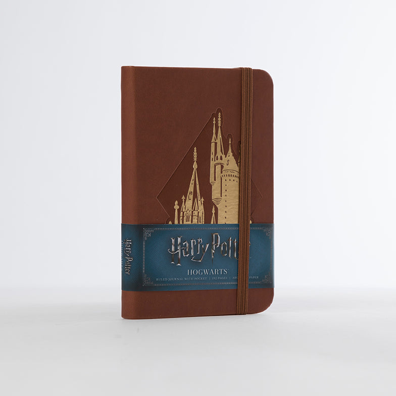 Hardcover Harry Potter Hogwarts ruled pocket journal by Insight Editions, featuring magical Hogwarts-themed cover design.