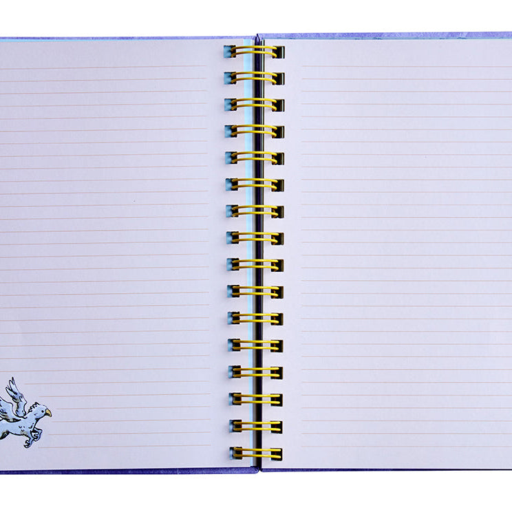 Hardcover Harry Potter spiral notebook by Insight Editions with magical themed cover design and lined pages inside.