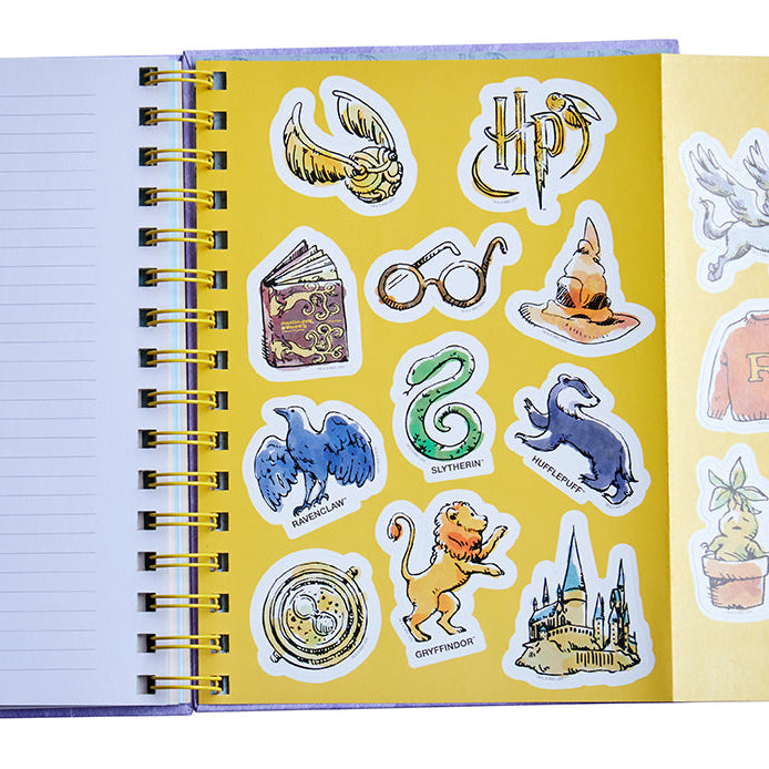 Hardcover Harry Potter spiral notebook by Insight Editions with magical cover design and lined pages for note-taking.