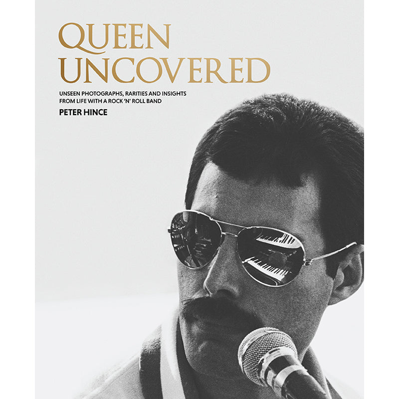 Hardcover book titled "Queen Uncovered" by Insight Editions, featuring a detailed cover with regal imagery.