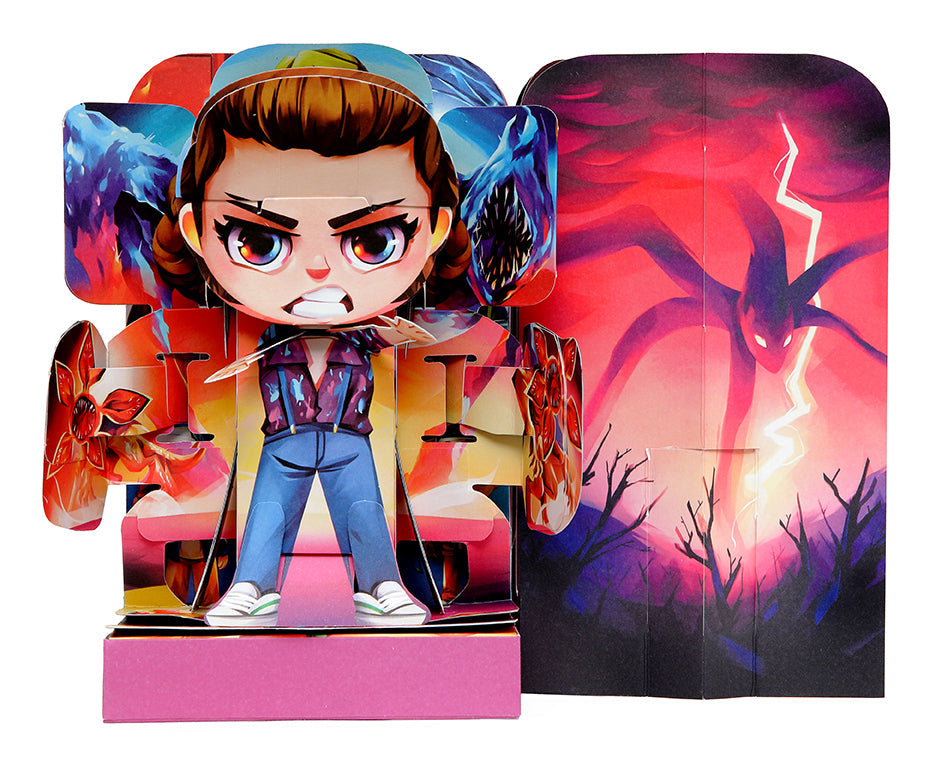 Hardcover Stranger Things Flip Pop: Eleven by Insight Editions featuring Eleven figure in a collectible book.