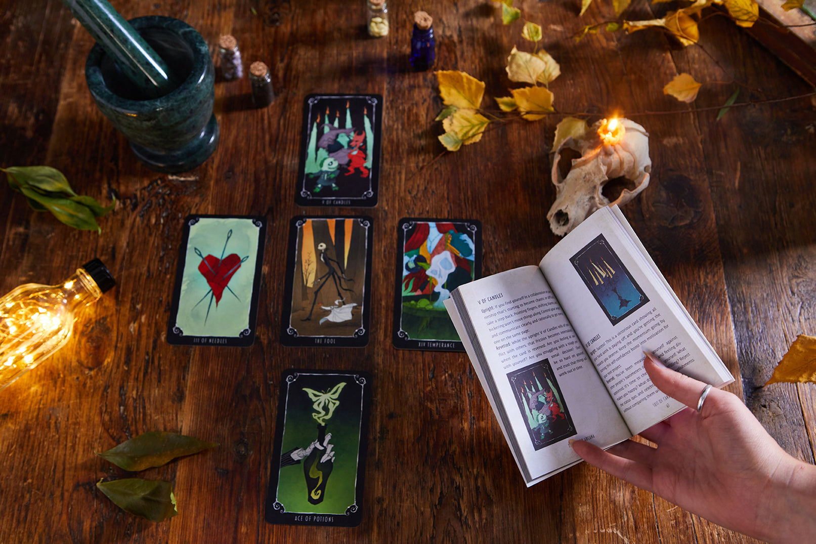 Hardcover The Nightmare Before Christmas Tarot Deck and Guidebook by Insight Editions, featuring spooky holiday-themed artwork.
