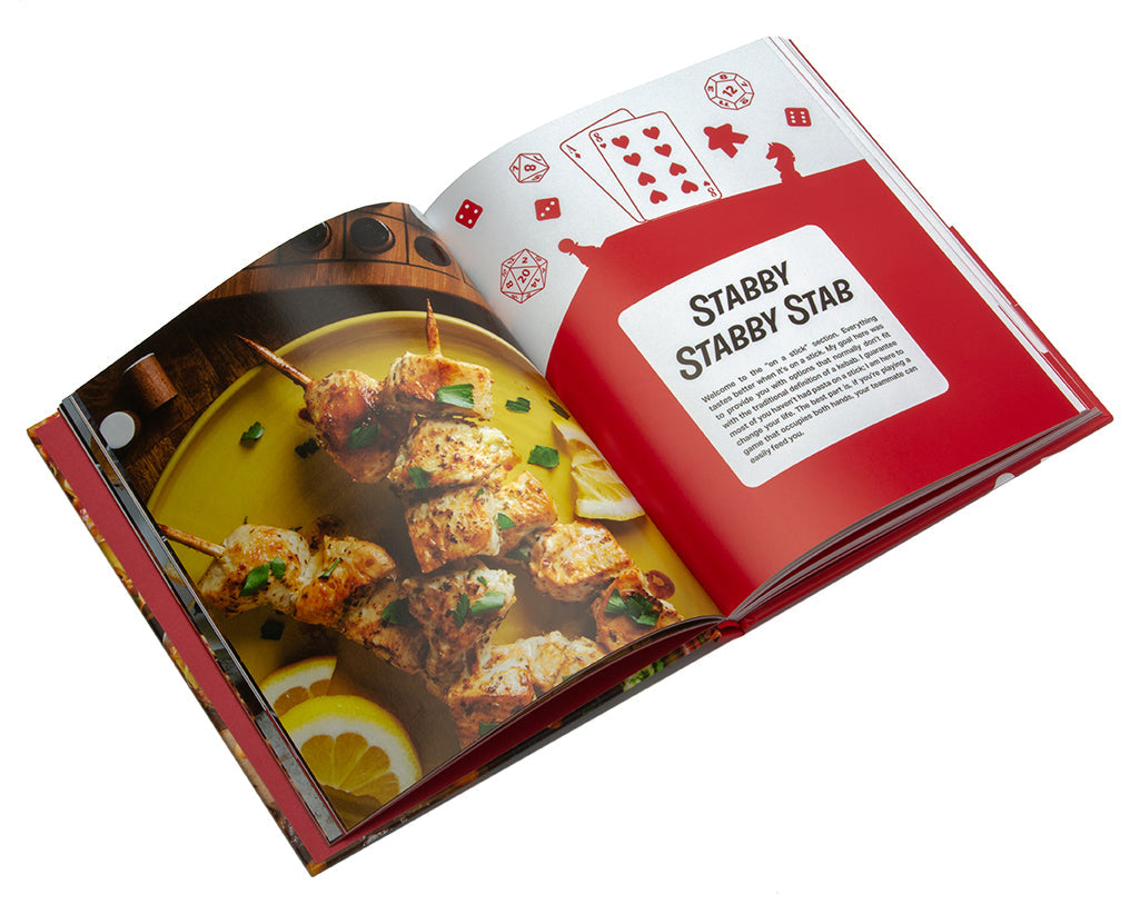 Hardcover of The Ultimate Gamers Cookbook by Insight Editions featuring colorful gaming-inspired recipes and food illustrations.