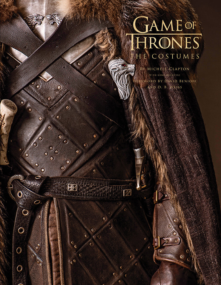Hardcover book with jacket featuring detailed images from Game of Thrones costumes by Insight Editions.