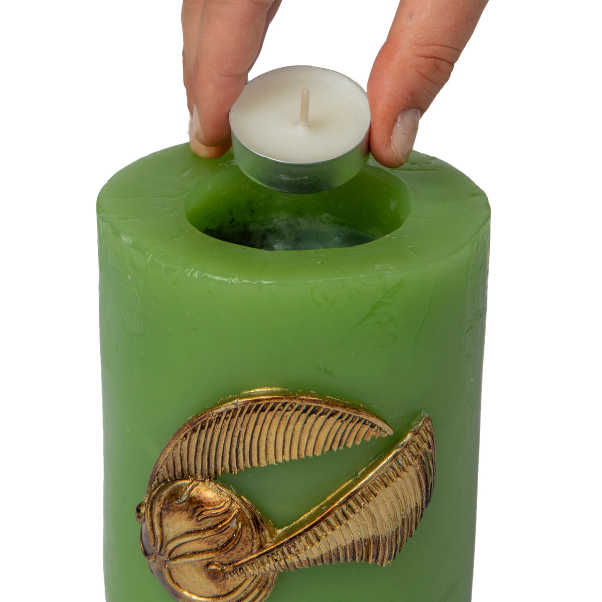 Harry Potter Golden Snitch sculpted insignia candle, detailed home decor featuring a magical design from Insight Editions.