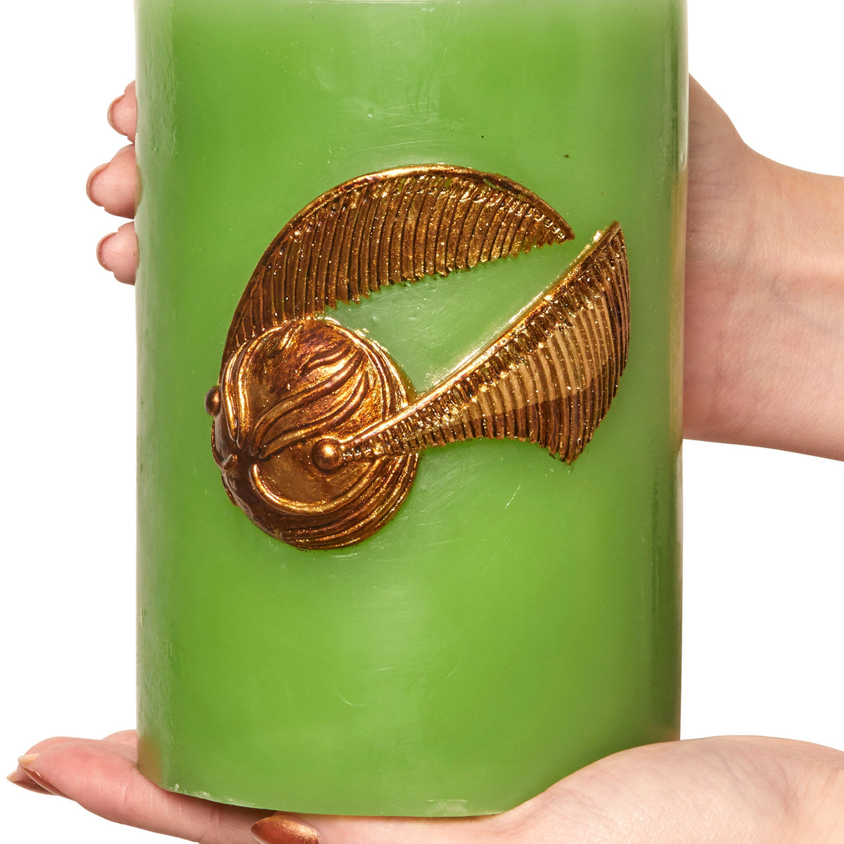 Harry Potter Golden Snitch sculpted insignia candle by Insight Editions, detailed home decor featuring a gold-colored Snitch design.