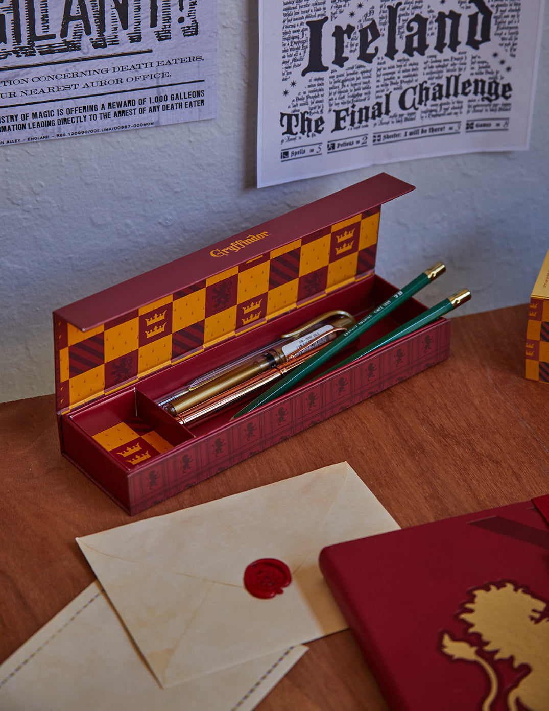 Gryffindor magnetic pencil box from Harry Potter by Insight Editions, featuring house crest and colorful design.