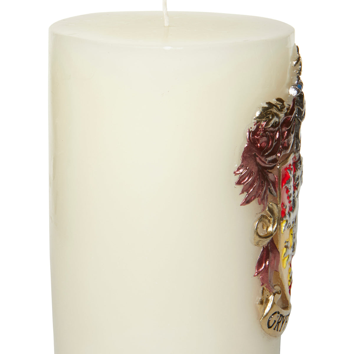 Gryffindor sculpted insignia candle from Harry Potter home goods collection by Insight Editions, featuring detailed house emblem design.