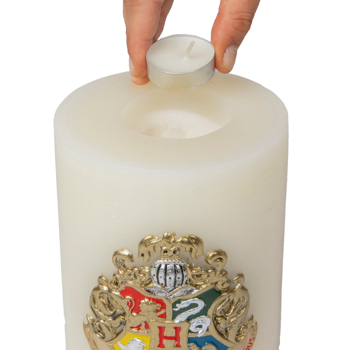 Large Harry Potter Hogwarts Insignia candle with sculpted design, ideal for home decor and magical ambiance.