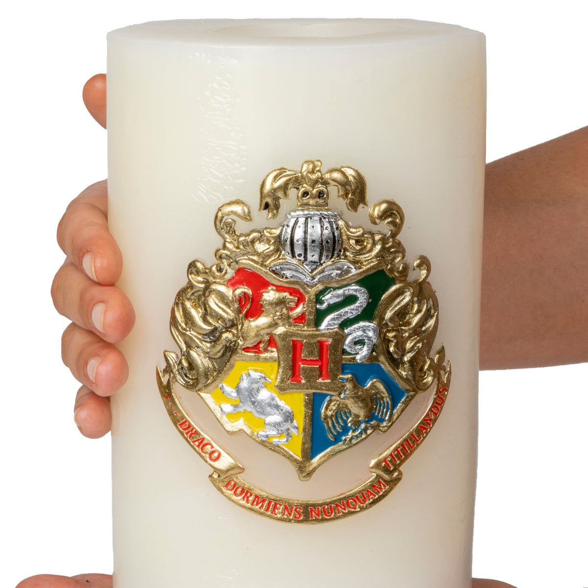 Large Harry Potter Hogwarts Insignia candle with sculpted design, ideal for home decor and Harry Potter fans.