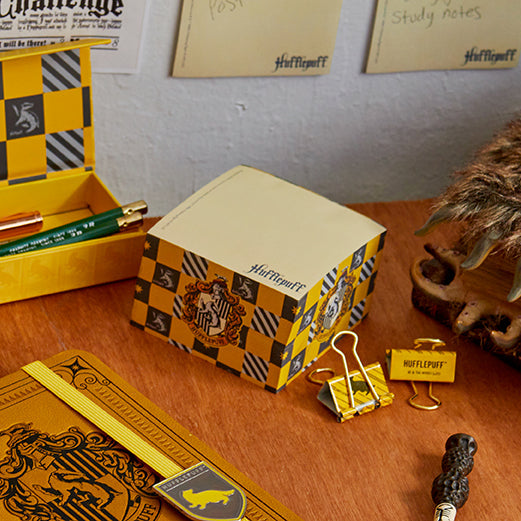 Harry Potter Hufflepuff Memo Cube from Insight Editions, featuring yellow and black Hufflepuff house design and branding.