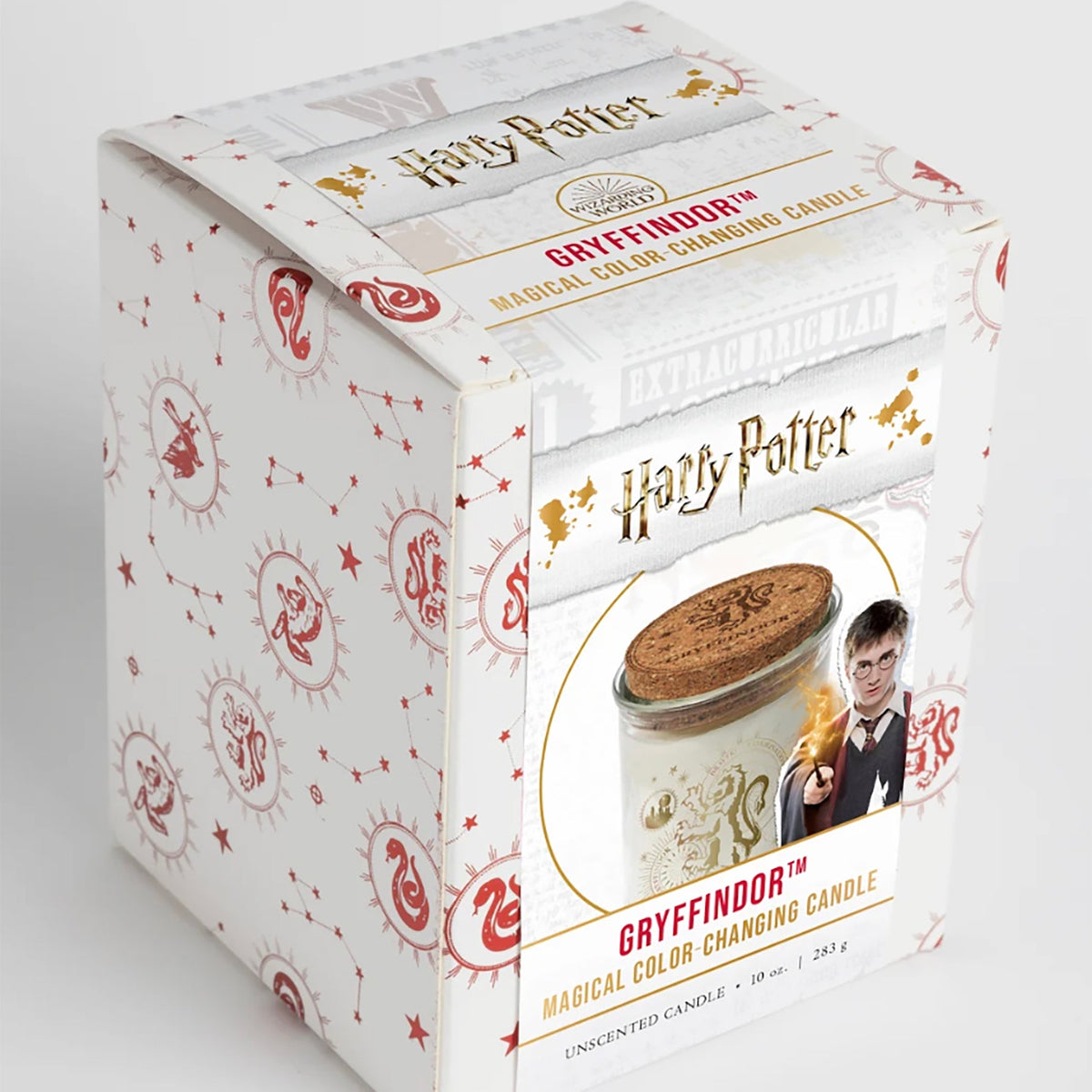 Color-changing Gryffindor candle from Harry Potter by Insight Editions, featuring a detailed Gryffindor crest design.