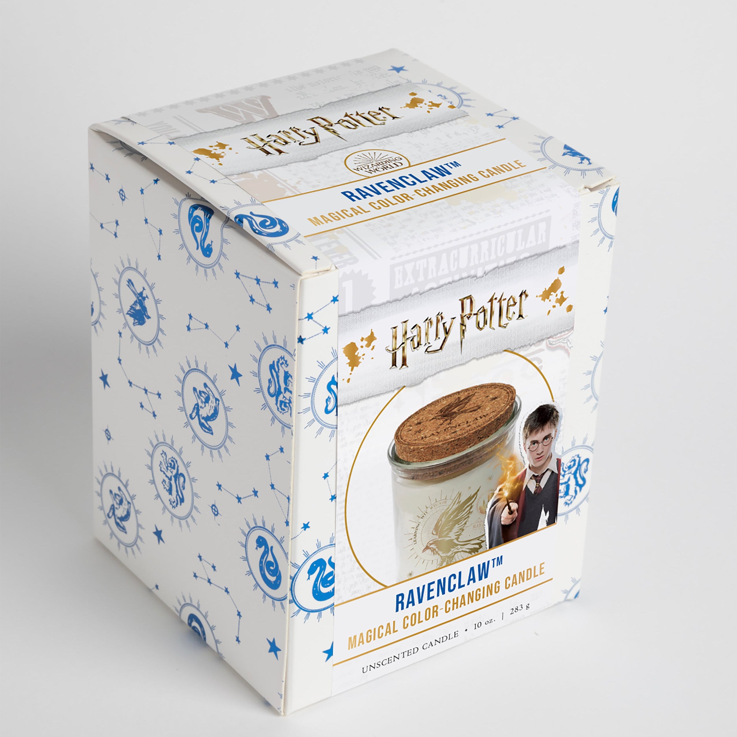 Color-changing Ravenclaw candle from Harry Potter by Insight Editions, featuring intricate Ravenclaw house design in a home decor setting.