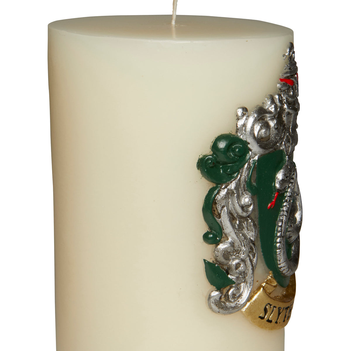 Slytherin insignia candle from Harry Potter series featuring a sculpted green Slytherin emblem on a ceramic candle holder.