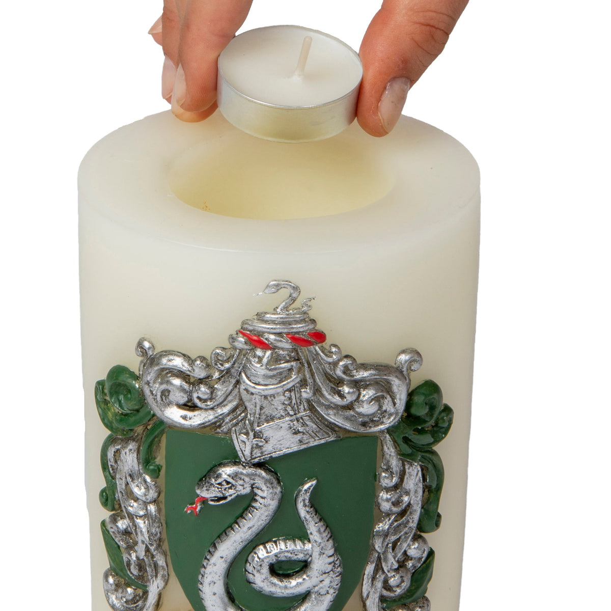 Slytherin insignia candle from Harry Potter featuring sculpted design, ideal for home decor and fandom display.
