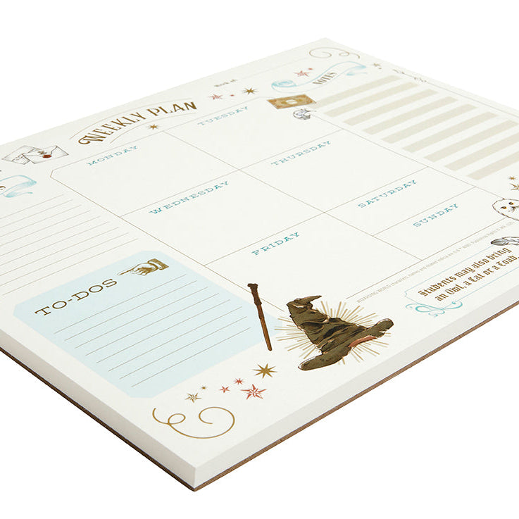 Interior view of Harry Potter weekly planner notepad by Insight Editions, featuring themed pages and writing space for home organization.