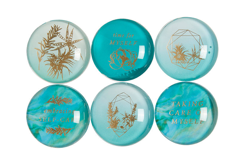 Set of six self-care glass magnets from Insight Editions, featuring colorful, inspirational designs for home decor.