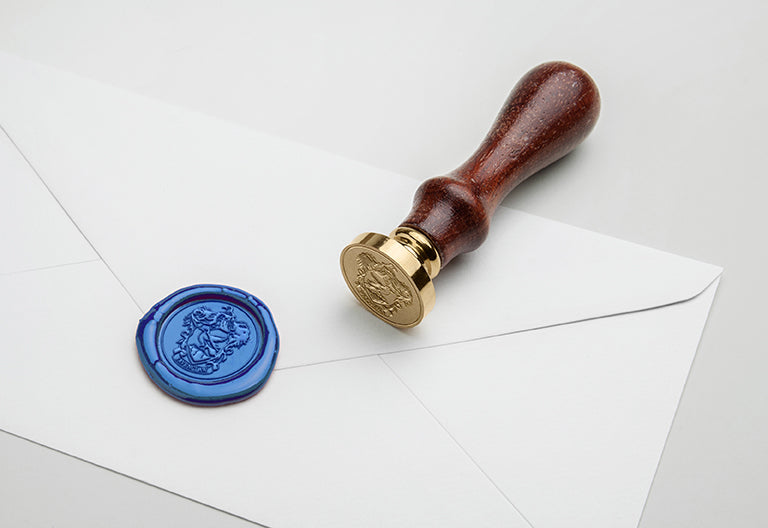 Harry Potter Ravenclaw wax seal set kit with blue wax, Ravenclaw emblem stamp, and sealing accessories from Insight Editions.