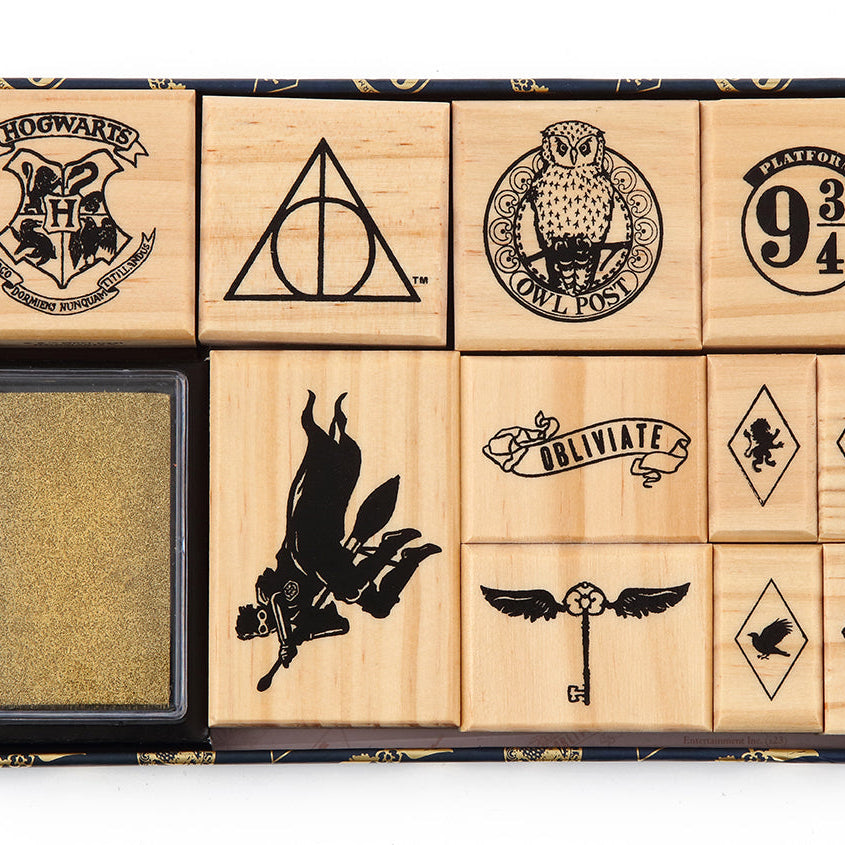 Harry Potter Welcome to Hogwarts rubber stamp set by Insight Editions featuring magical house symbols and Hogwarts-themed designs.