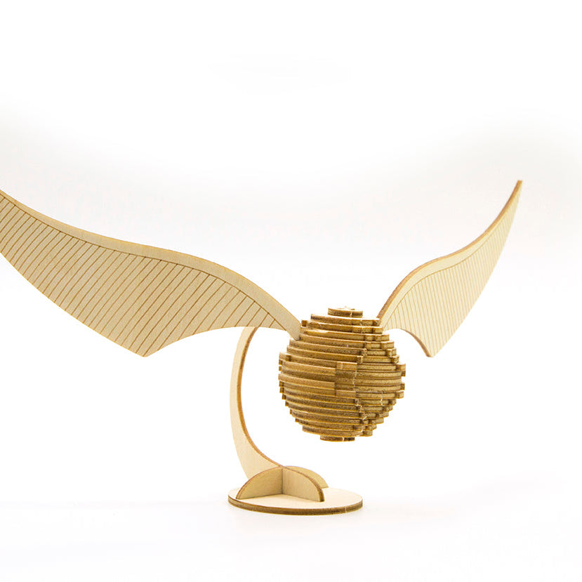 Harry Potter Golden Snitch 3D wood model and book kit by Insight Editions, featuring detailed craftsmanship and packaging.