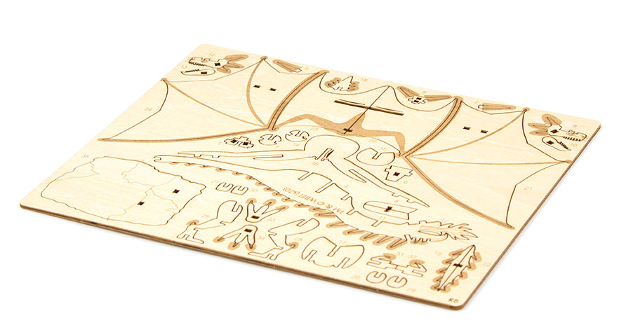 IncrediBuilds Harry Potter Hungarian Horntail kit with a 3D wood model and book, featuring detailed dragon and magical design.