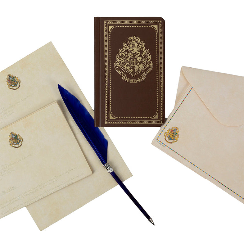 Harry Potter Hogwarts stationery set with themed desk accessories and pen, featuring magical designs from Insight Editions.