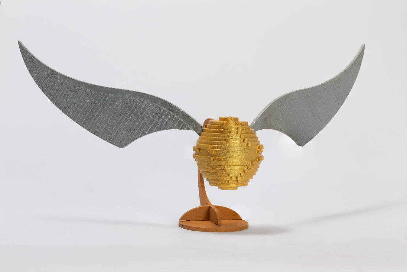 IncrediBuilds Harry Potter Golden Snitch 3D wood model kit, featuring detailed wooden craft of the iconic Quidditch game object.