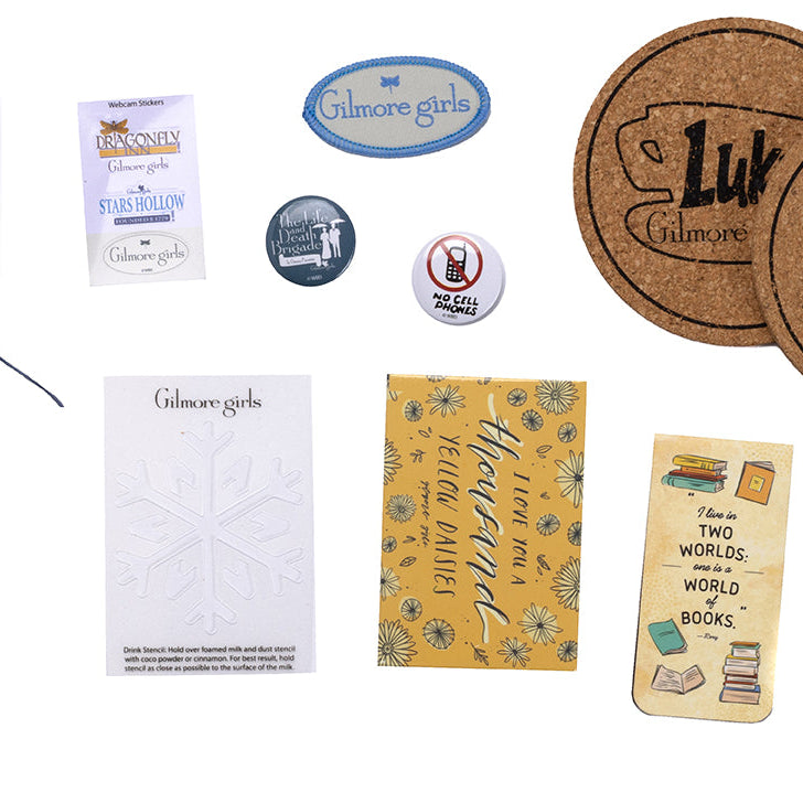 Hardbound Gilmore Girls: The Official Advent Calendar kit by Insight Editions, featuring themed pages and decorative elements inside.