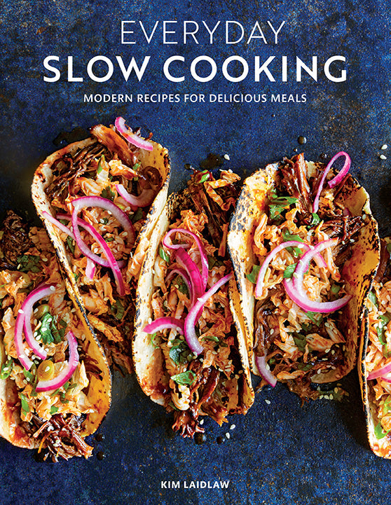 Softcover copy of "Everyday Slow Cooking" cookbook by Insight Editions, featuring a cozy kitchen scene on the cover.