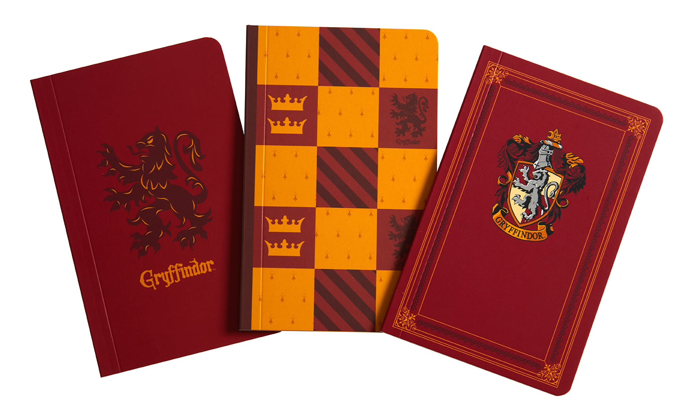 Set of three Harry Potter Gryffindor softcover pocket notebooks from Insight Editions, featuring house crest and magical design.