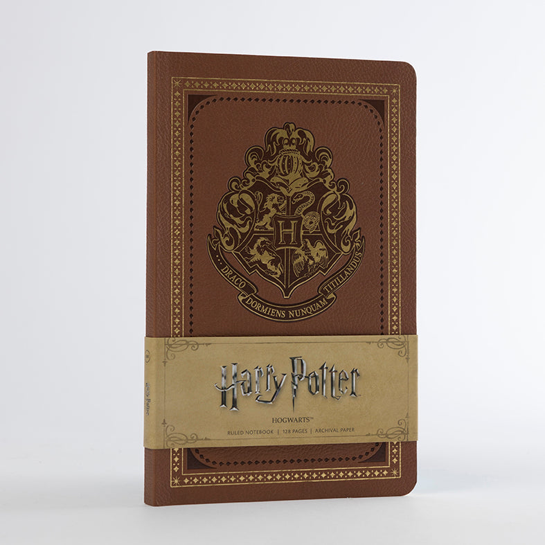 Softcover Harry Potter Hogwarts ruled notebook by Insight Editions with enchanted design on the cover.