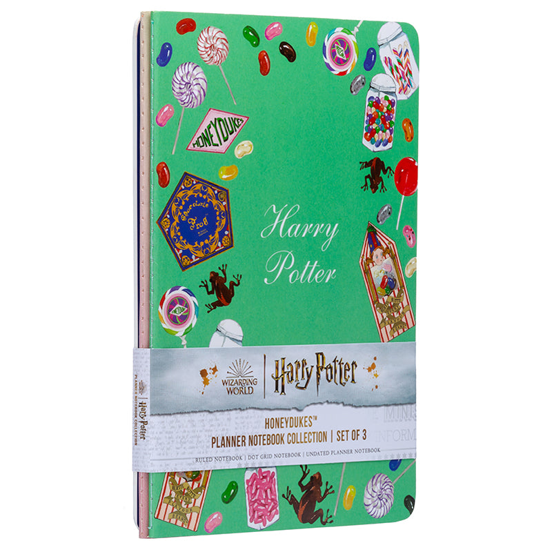 Set of three Harry Potter Honeydukes planner notebooks with softcover covers from Insight Editions featuring magical candy-themed designs.