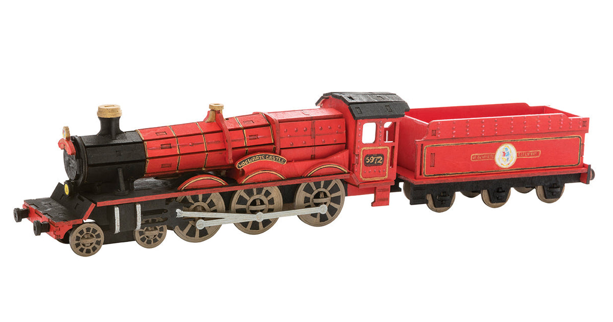 Open softcover Harry Potter Hogwarts Express book with 3D wood model and detailed interior illustrations by Insight Editions.